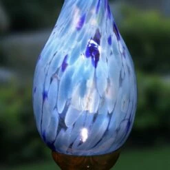 Coupon ✨ 30" Pearlized Glass Solar Flame Stake Light Blue - Exhart 🎁 -Garden Decor Shop unnamed file 3285